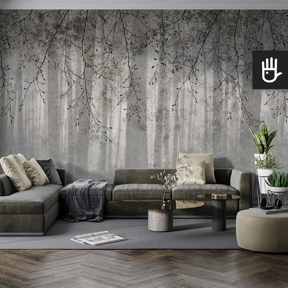 Nowoczesny salon w szarej tonacji z tapetą z gałęziami i widokiem lasu o fakturze i kolorze betonu