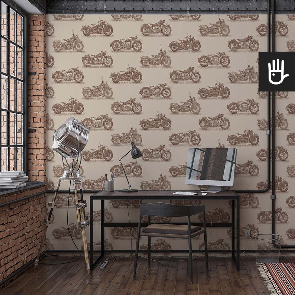 Loft z pracownią w stylu industrialnym z dekoracją ścienną, którą jest tapeta stare motocykle - brąz