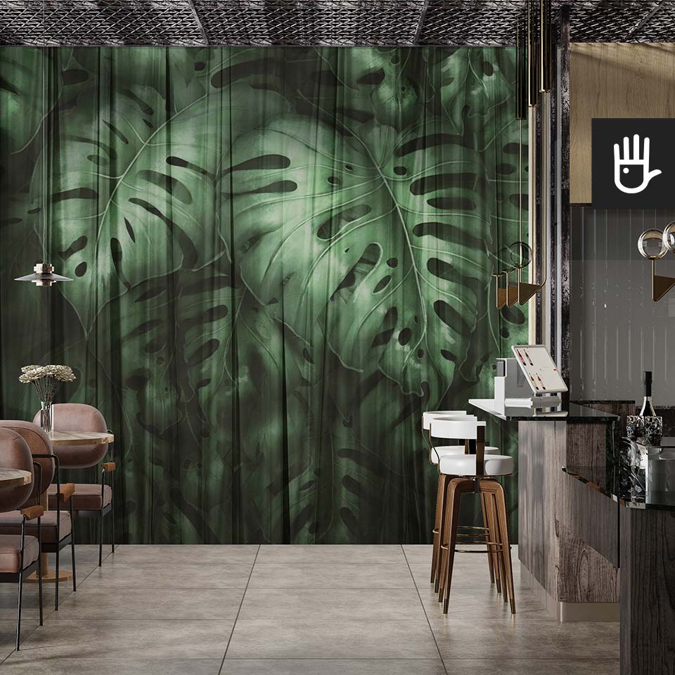 Loftowe wnętrze kawiarni z barem z elegancką tapetą ścienną z motywem ogromnych tropikalnych liści w kolorze zieleni boho pod nazwą fototapeta monstera