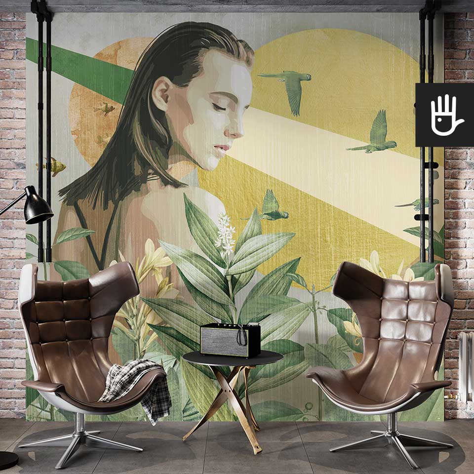 Loftowe studio ze skórzanymi fotelami z dekoracyjną ścianą ozdobioną fototapetą z kobietą i bujną roślinnością