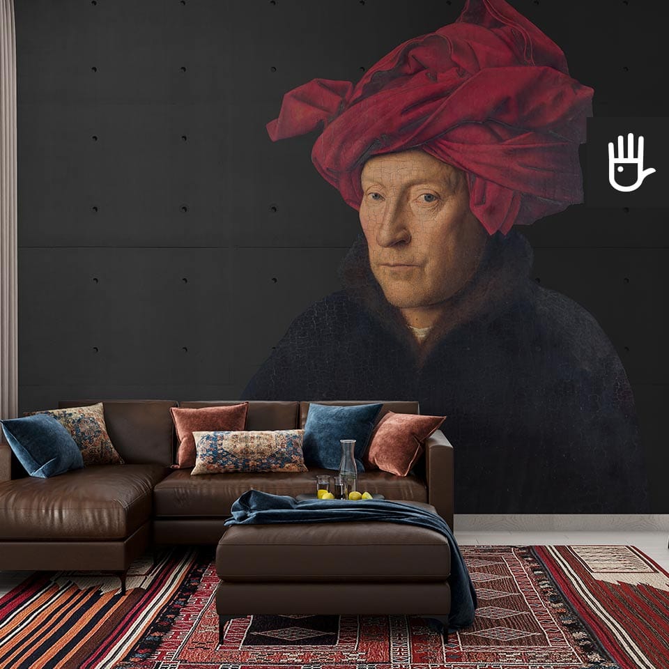 Przytulny salon ze skórzaną kanapą z wieloma dekoracyjnymi poduszkami na tle fototapety mężczyzna w turbanie