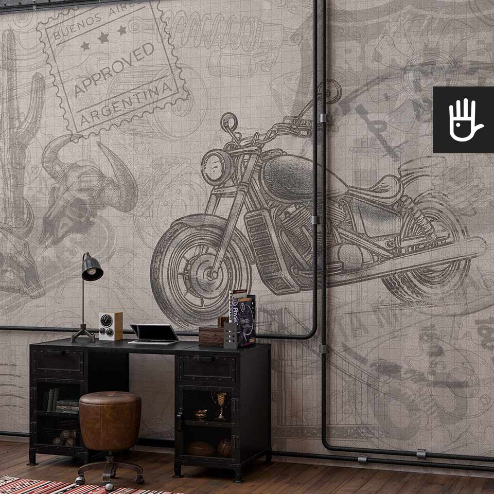 Biuro w stylu loftowym z metalowym czarnym biurkiem i skórzanym pufem na tle fototapety z motocyklem i elementami nawiązującymi do amerykańskiej kultury