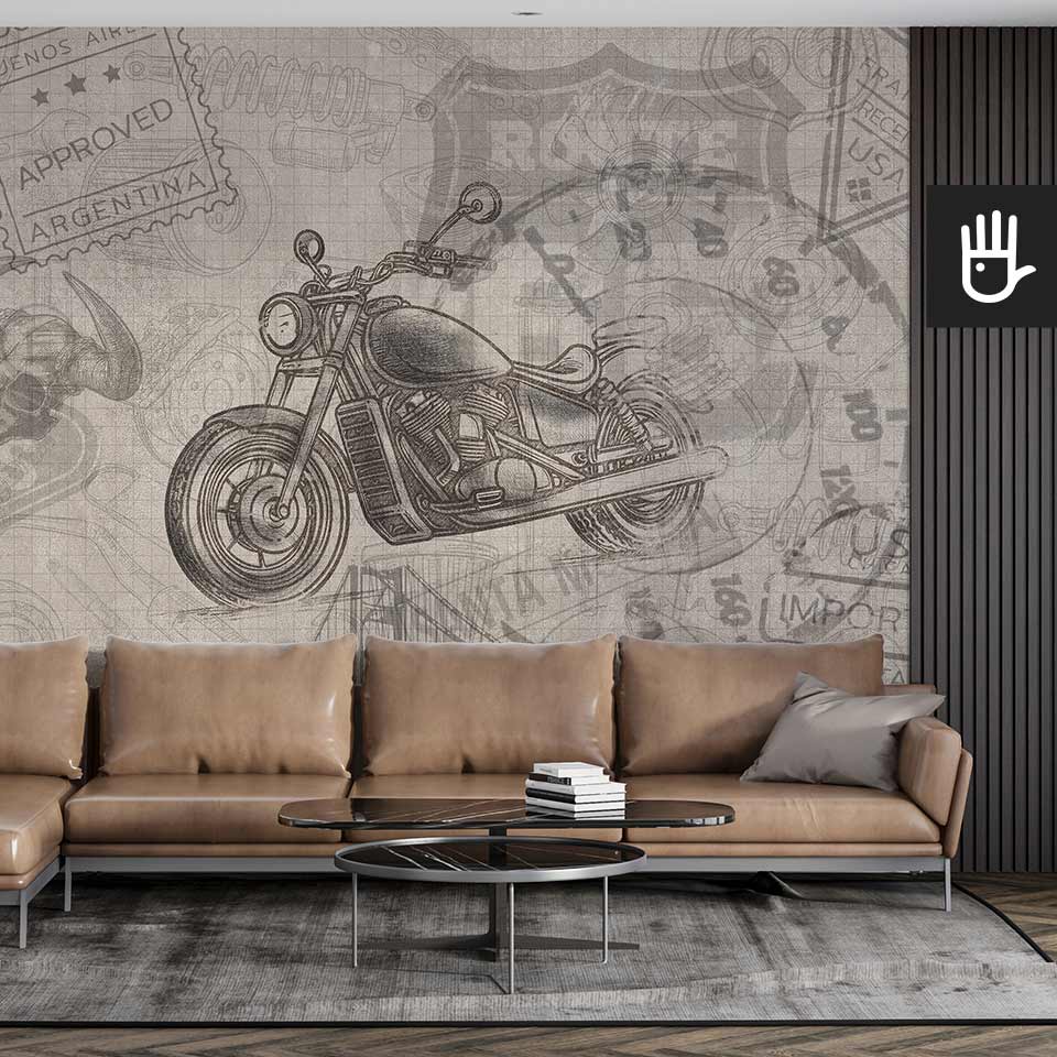 Jasny salon w stylu industrialnym ze skórzana kanapą i czarnymi lamelami obok fototapety ze wzorem motocykla i elementami związanymi z kulturą amerykańską